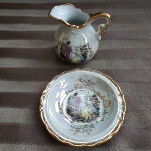 Vintage small pitcher and saucer.